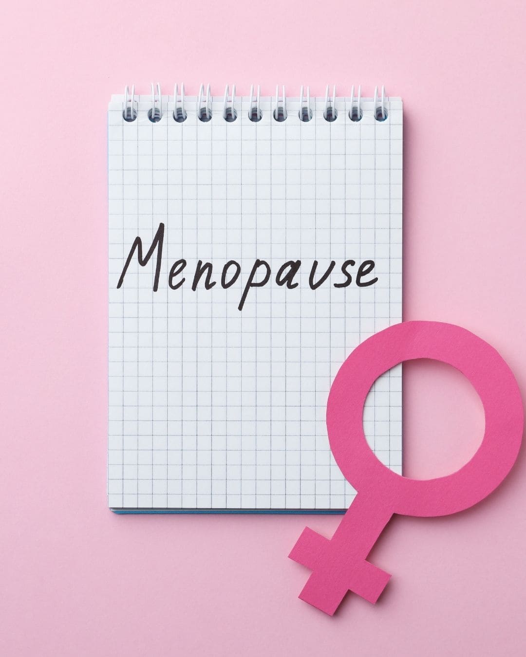 notepad with menopause written on it representing menopause self-care and awareness