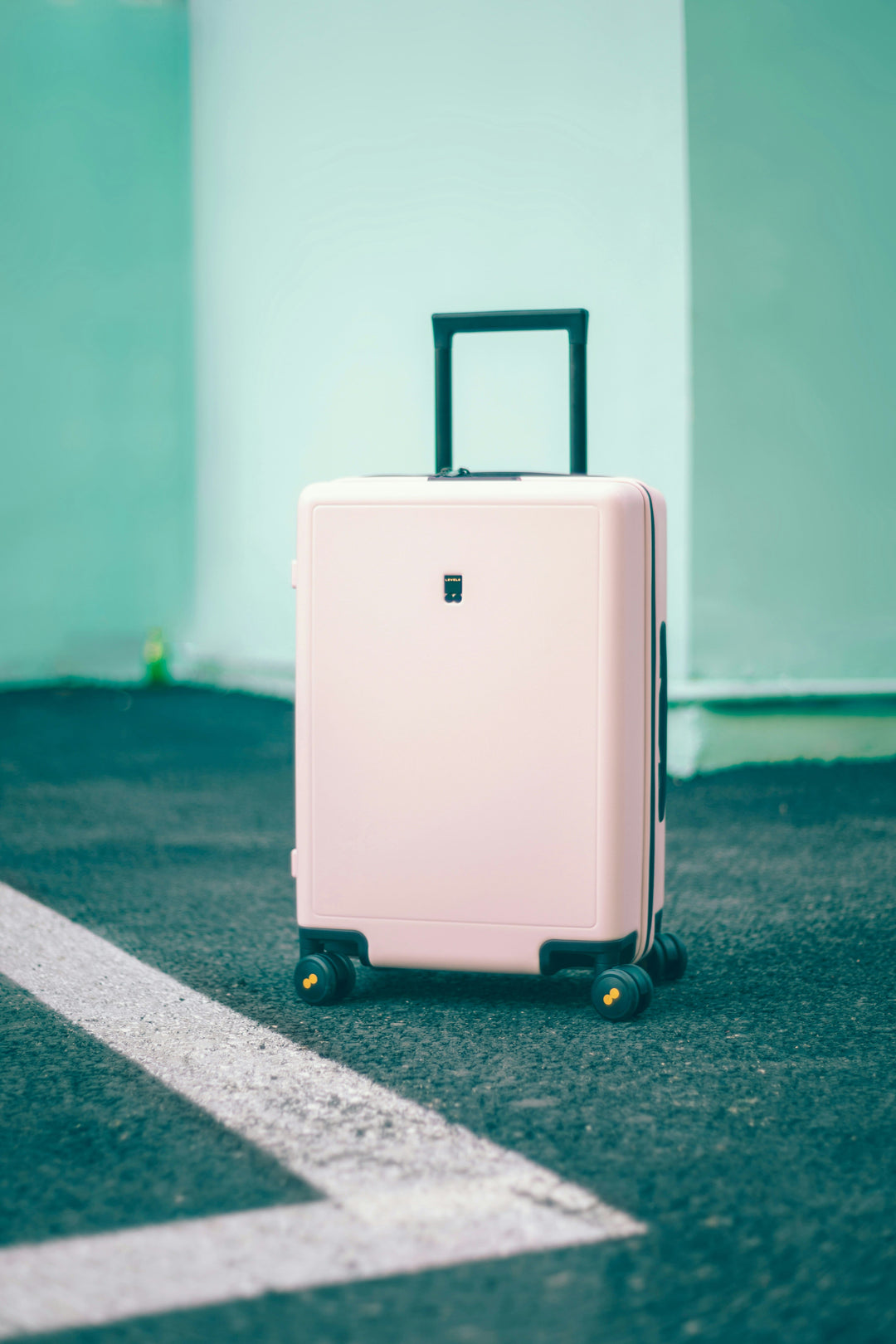 Dusty pink suitcase packed for a stylish weekend getaway”