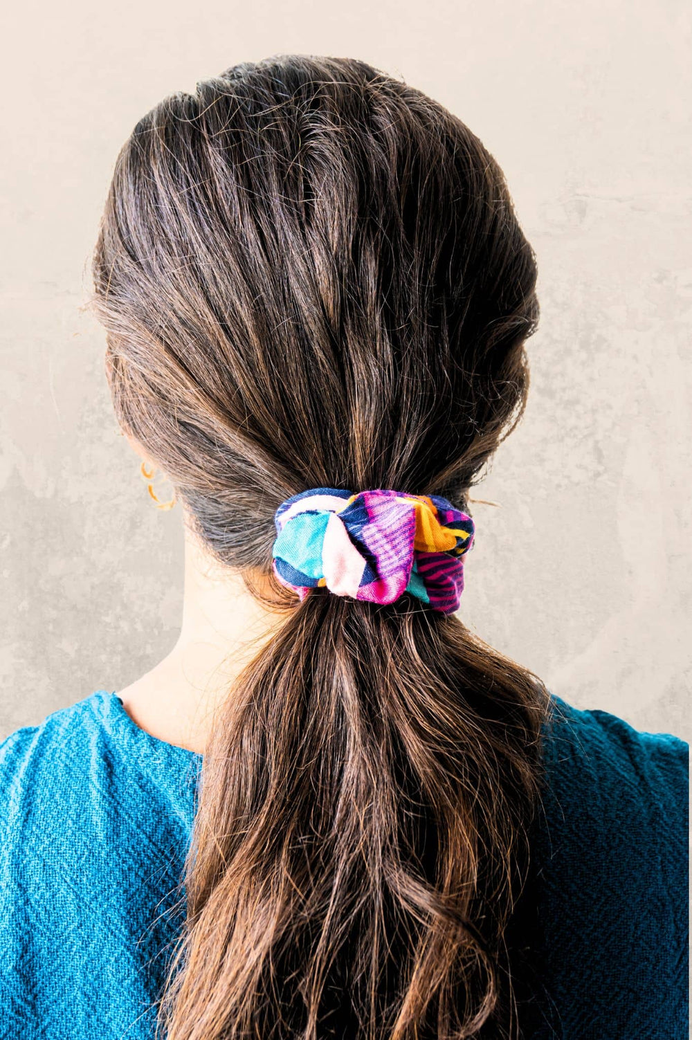Cancun print scrunchie on brown hair prevent hair frizz