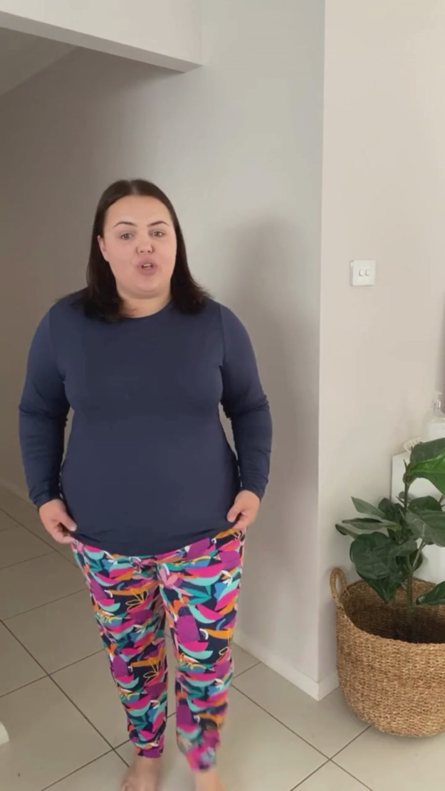 Model showcasing Kip & Boo bamboo sleepwear, wearing a Seminyak top paired with Cancun print pants, emphasising comfortable and sustainable women's nightwear in Australia